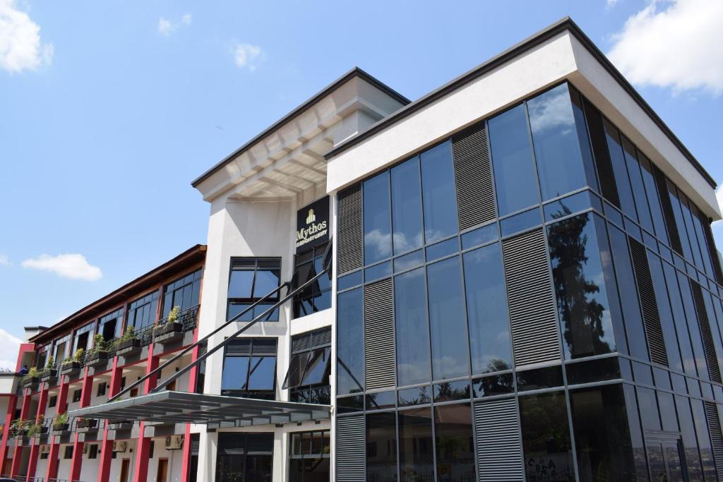an office building with large glass windows at Mythos Boutique Hotel in Kigali
