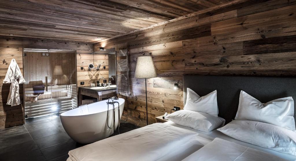 Łóżko lub łóżka w pokoju w obiekcie Chalet Cogolara