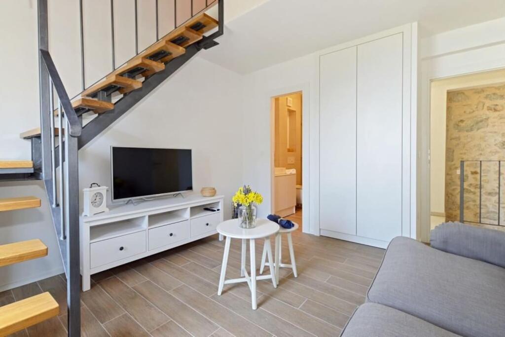 Televízia a/alebo spoločenská miestnosť v ubytovaní Holiday home Barbarella