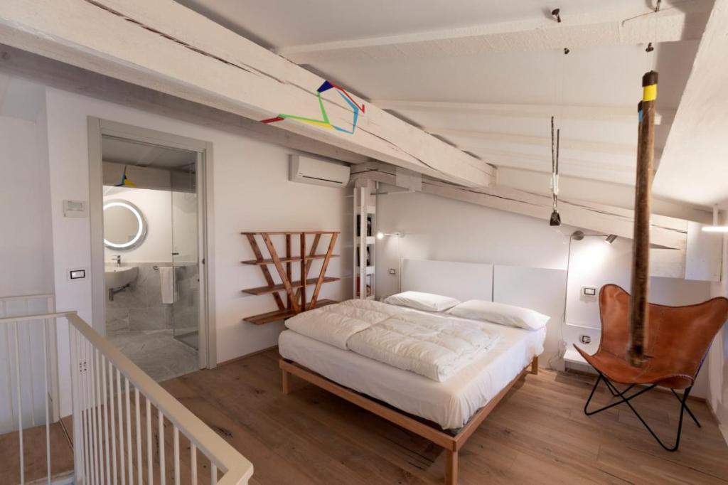 Postel nebo postele na pokoji v ubytování La Corte - Theater Home