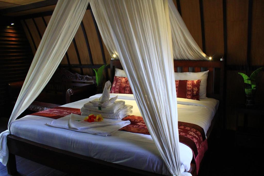 Postel nebo postele na pokoji v ubytování Turtle Beach Hotel