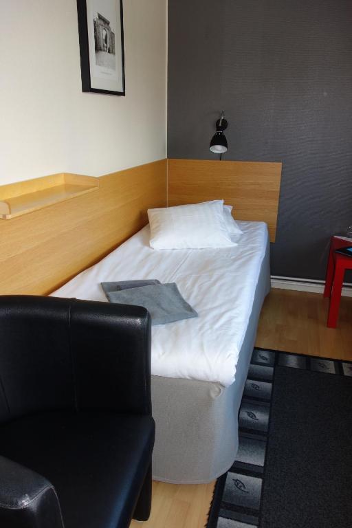 Postel nebo postele na pokoji v ubytování Hotell Svanen