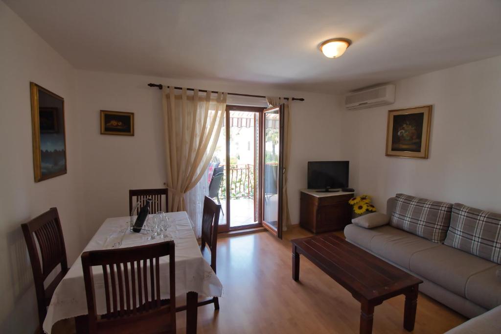 TV a/nebo společenská místnost v ubytování Apartments SI