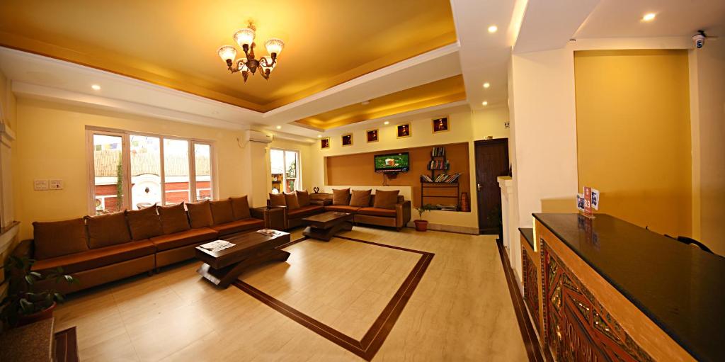 TV a/nebo společenská místnost v ubytování DOM Himalaya Hotel