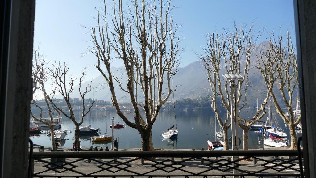 a view of a harbor with boats in the water at La Casa sul Lago Lecco in Lecco