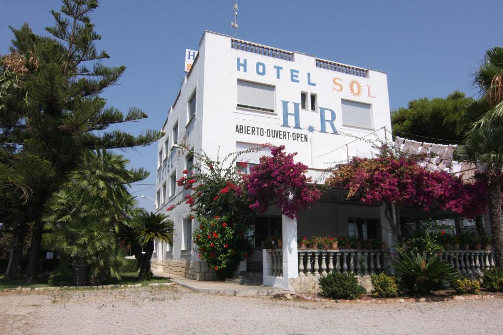 a hotel with flowers in front of a building at Hotel Sol in Benicarló