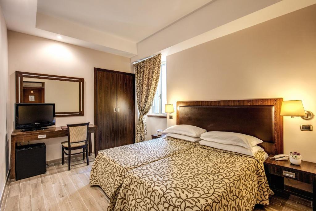 Säng eller sängar i ett rum på Hotel Villafranca