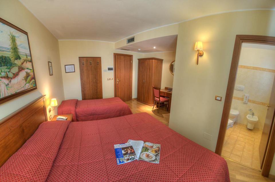 Postel nebo postele na pokoji v ubytování Hotel Garnì Posta