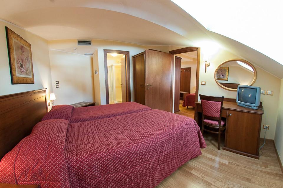 Postel nebo postele na pokoji v ubytování Hotel Garnì Posta