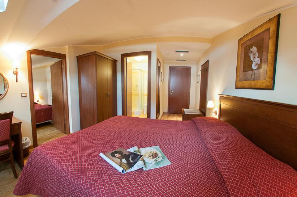 Postel nebo postele na pokoji v ubytování Hotel Garnì Posta