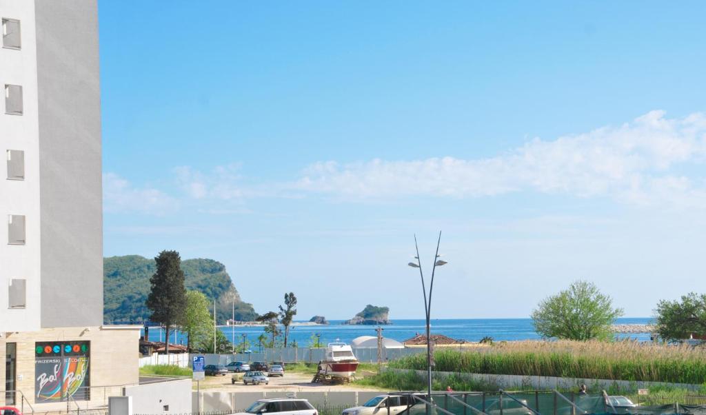 a view of the ocean from a parking lot at Adelisa Apartments in Budva