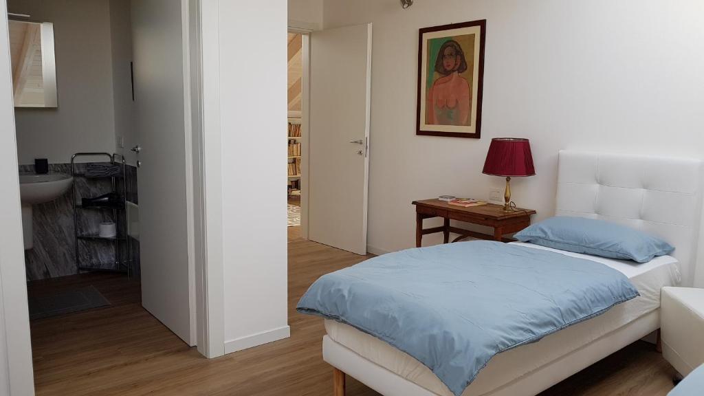 Łóżko lub łóżka w pokoju w obiekcie DE PIANTE GUEST