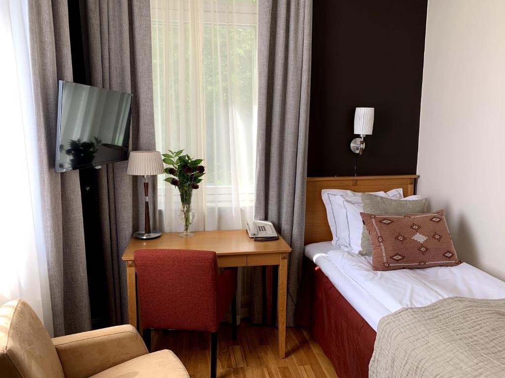 Postel nebo postele na pokoji v ubytování Näsby Slott
