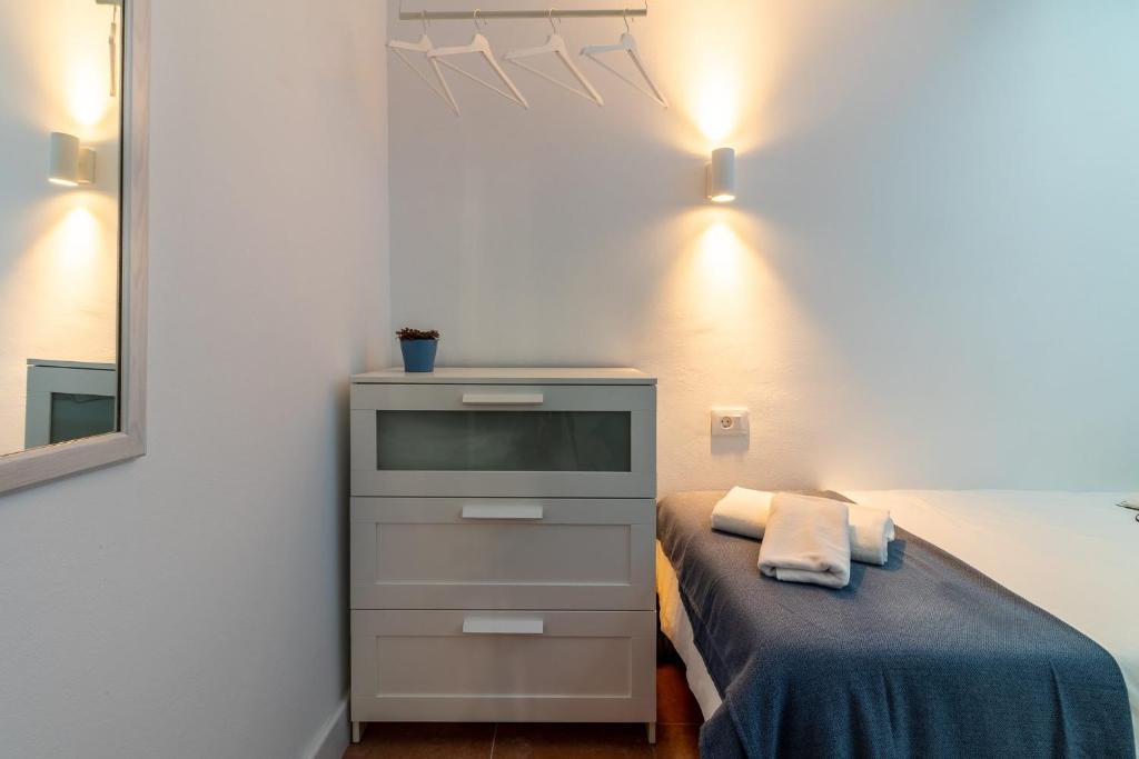 Łóżko lub łóżka w pokoju w obiekcie Flatguest Villa Yaiza