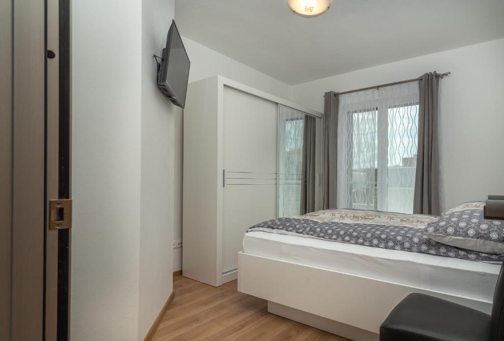 Postel nebo postele na pokoji v ubytování Villa Confido Luxury Apartment 01