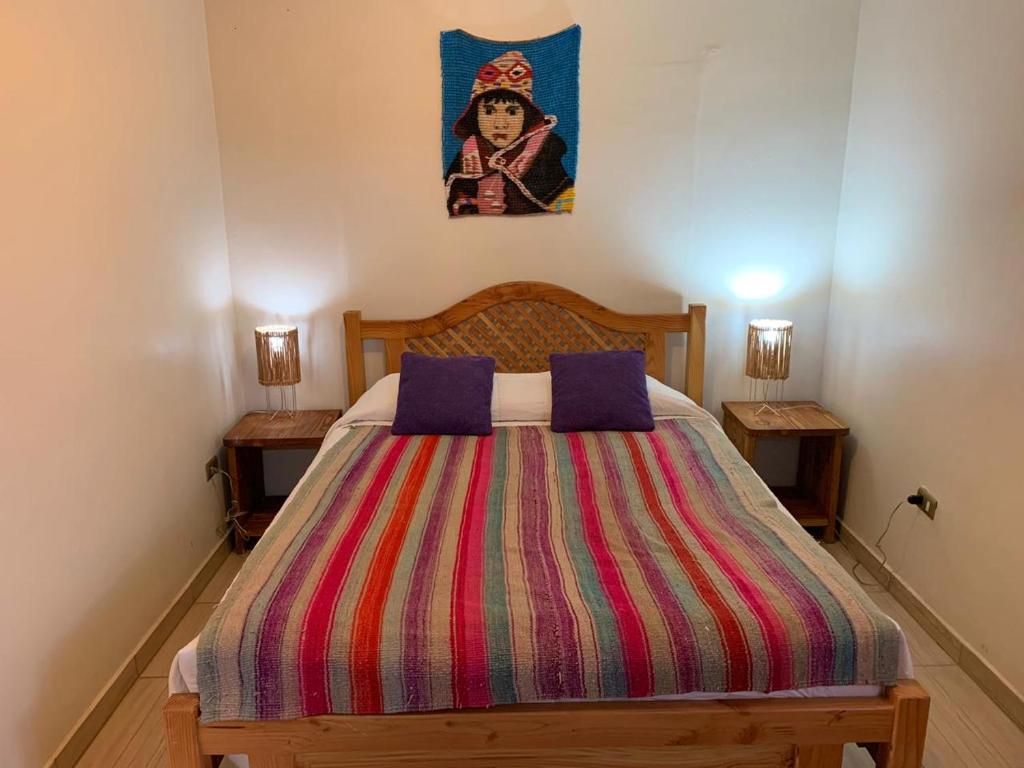 Postel nebo postele na pokoji v ubytování Hostal Nuevo Amanecer