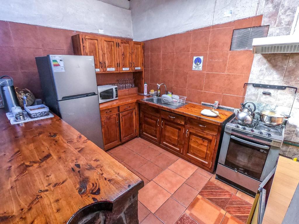 Kuchyň nebo kuchyňský kout v ubytování Hostal Nuevo Amanecer