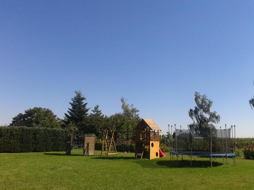 a park with a playground and a play structure at Pension Fennert in Pritzwald