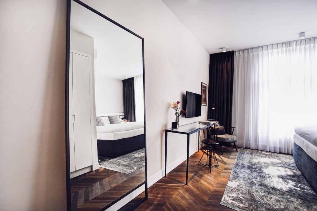 Postel nebo postele na pokoji v ubytování Morgan & Mees Amsterdam