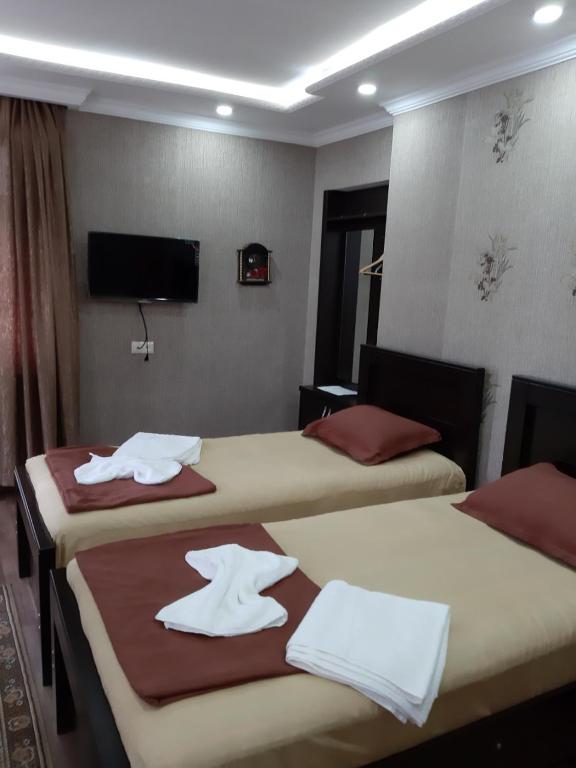 Postel nebo postele na pokoji v ubytování Hotel Mariana