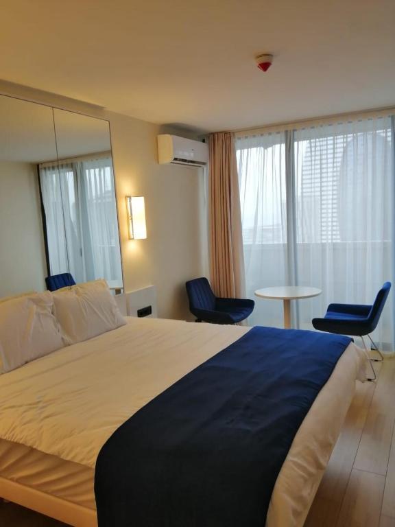 Postel nebo postele na pokoji v ubytování Lamar hotel