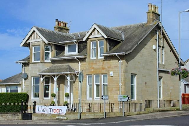 a large house on the corner of a street at Rooms by No2 Troon Road in Troon