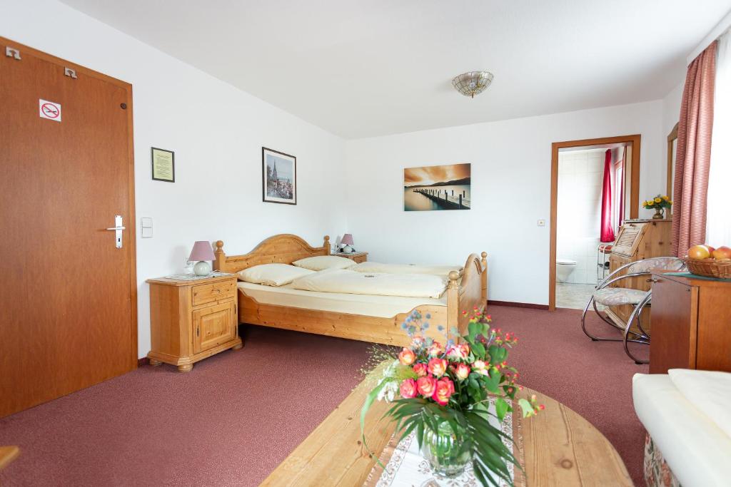Postel nebo postele na pokoji v ubytování Hotel Silberdistel
