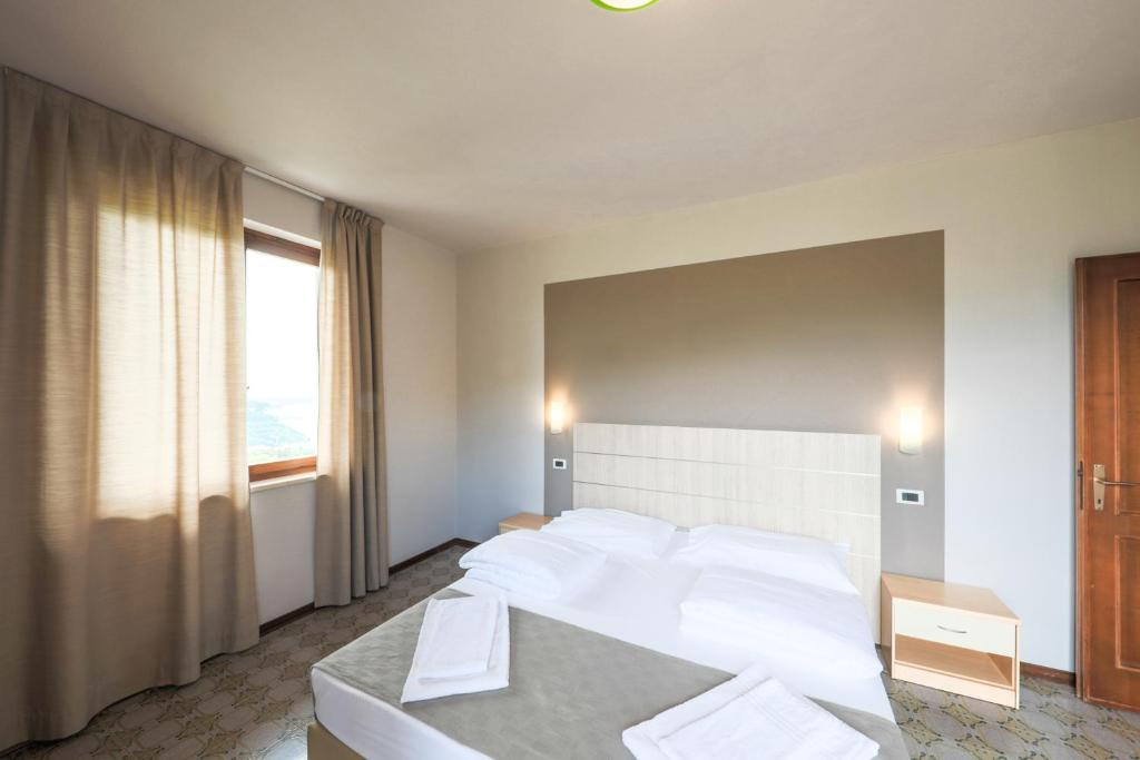 Postel nebo postele na pokoji v ubytování Residence San Michele