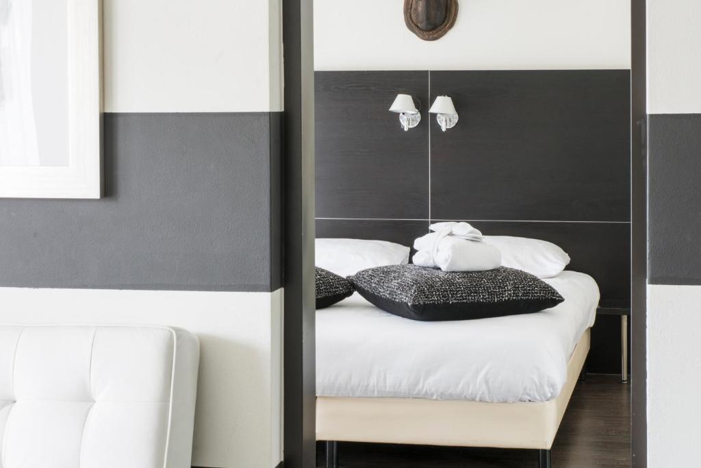 Postel nebo postele na pokoji v ubytování Fletcher Hotel Landgoed Avegoor