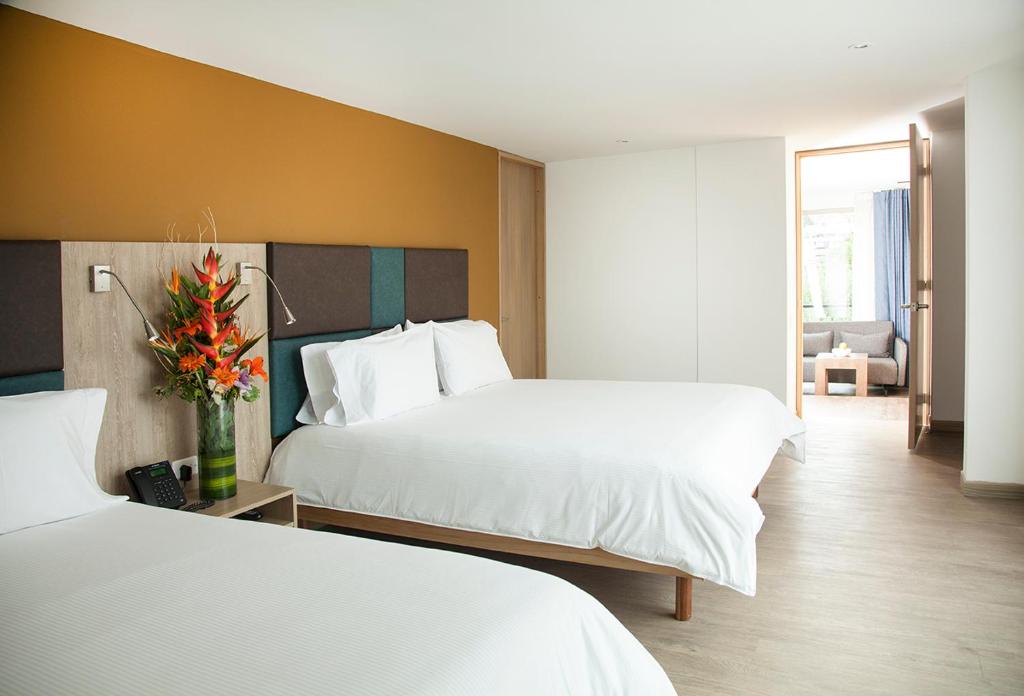 Postel nebo postele na pokoji v ubytování Hotel Viaggio Teleport City Suites