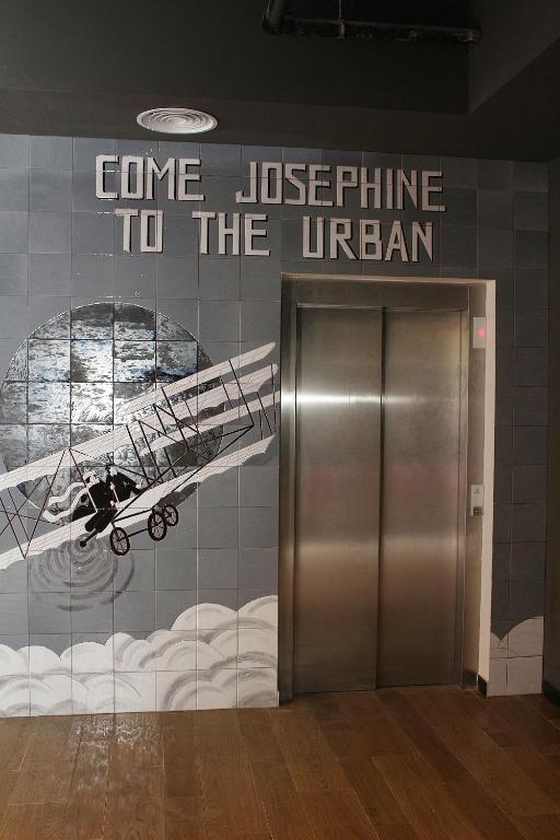 a metal elevator in a building with a sign at Urban Anaga Hotel in Santa Cruz de Tenerife