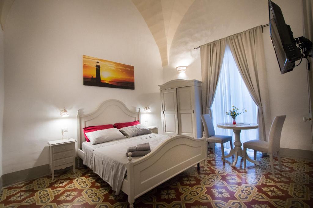 Posteľ alebo postele v izbe v ubytovaní Le Finestre Su Porta Carrese - Luxury Rooms