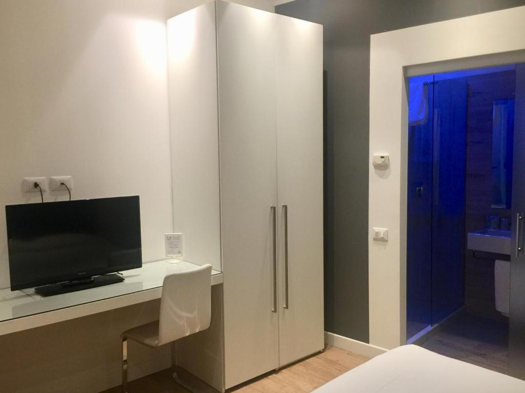 Postel nebo postele na pokoji v ubytování Hotel La Loggia