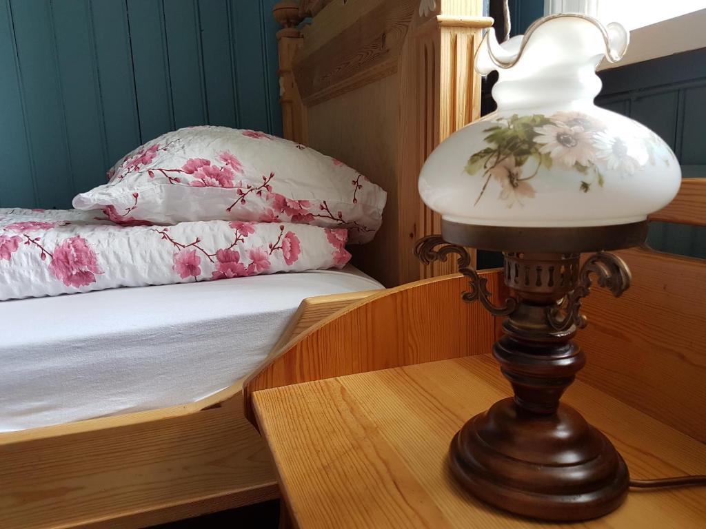 Postel nebo postele na pokoji v ubytování Guesthouse Gamli Bær