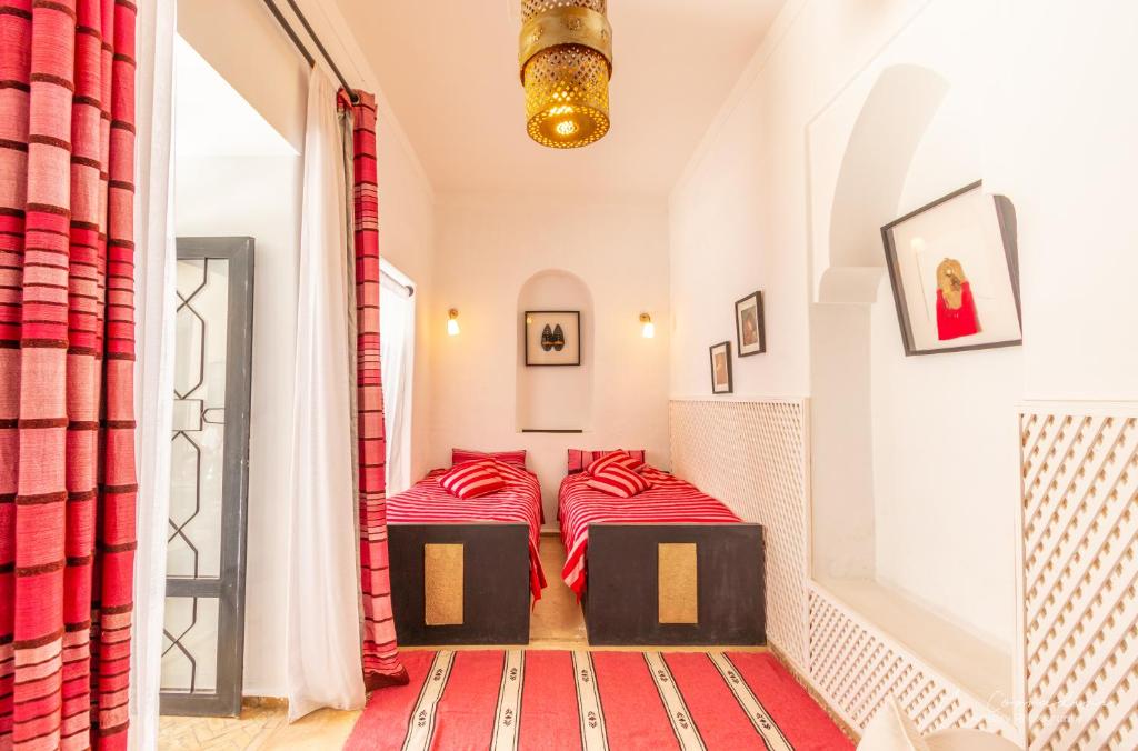Postel nebo postele na pokoji v ubytování Riad Dar El Masa