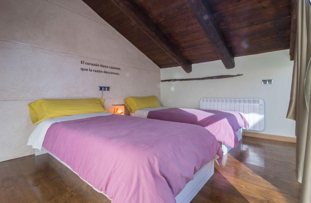 Postel nebo postele na pokoji v ubytování Tiempo de Ensueño