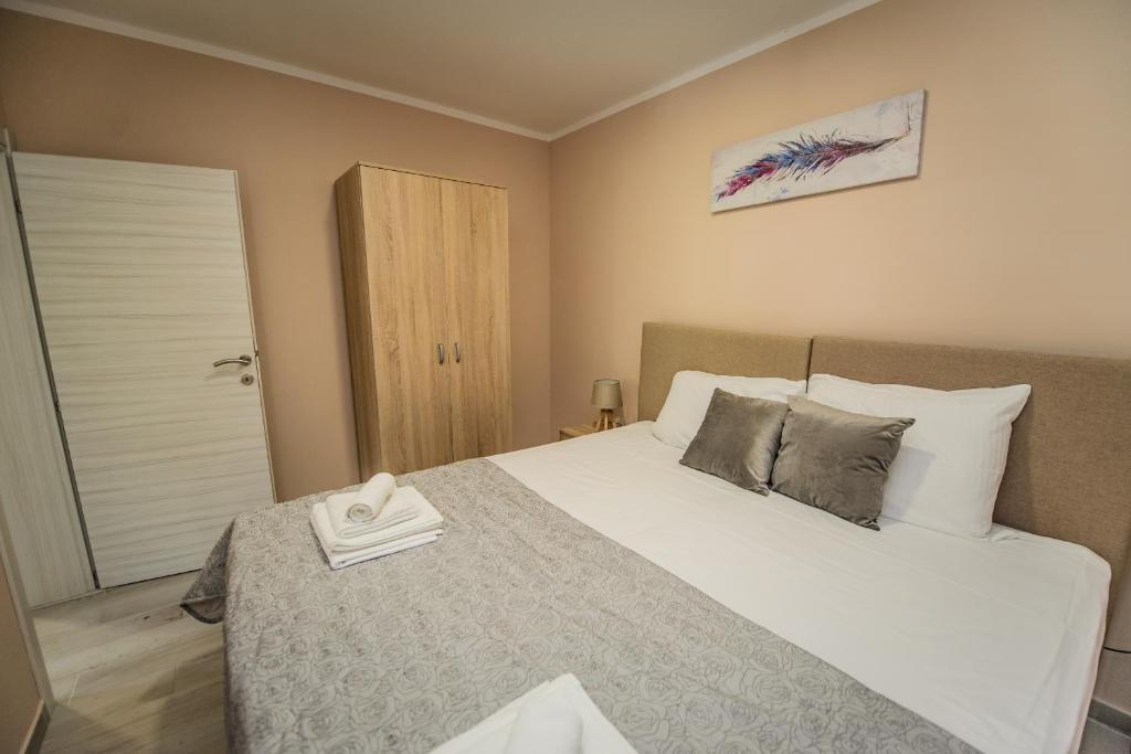 Postel nebo postele na pokoji v ubytování Apartment Vrutak