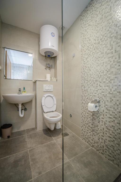 Koupelna v ubytování Apartment Vrutak