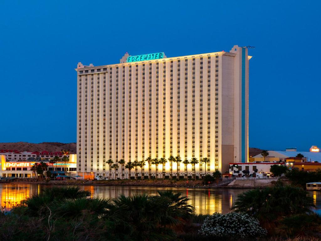 a large hotel with a lit up building at The Edgewater Hotel and Casino in Laughlin