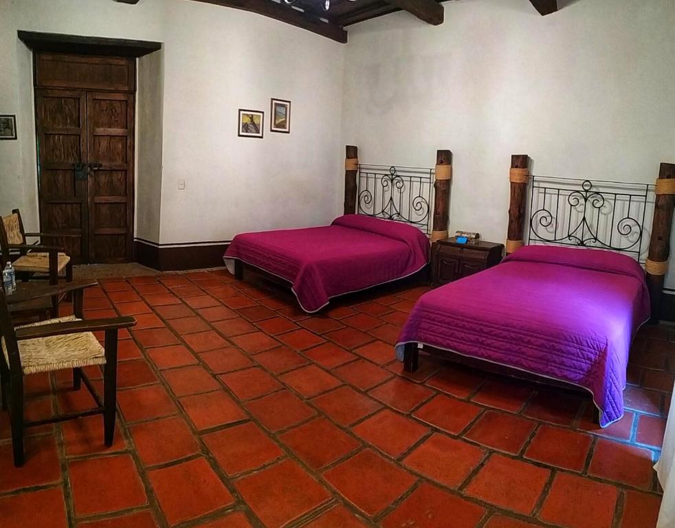 Postel nebo postele na pokoji v ubytování La Casona De La Esmeralda