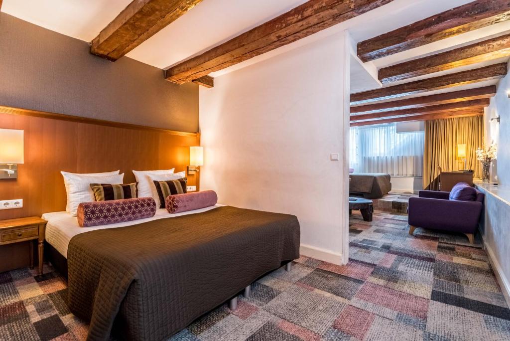 Postel nebo postele na pokoji v ubytování Hotel Amstelzicht