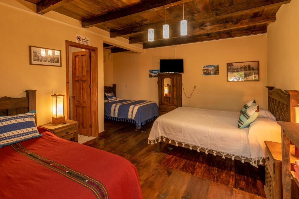 Postel nebo postele na pokoji v ubytování MYKONOS - Adult Hotel