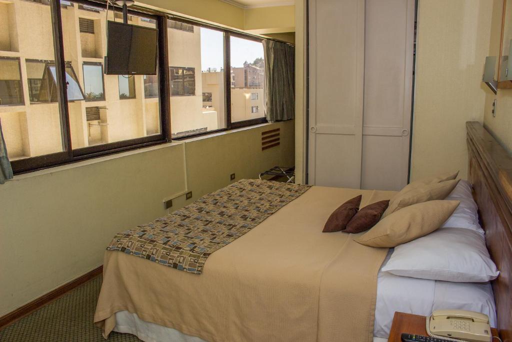 Postel nebo postele na pokoji v ubytování Gala Hotel