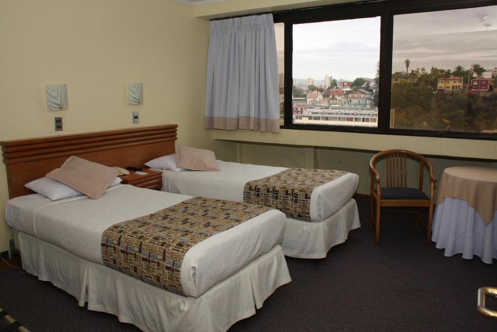 Postel nebo postele na pokoji v ubytování Gala Hotel