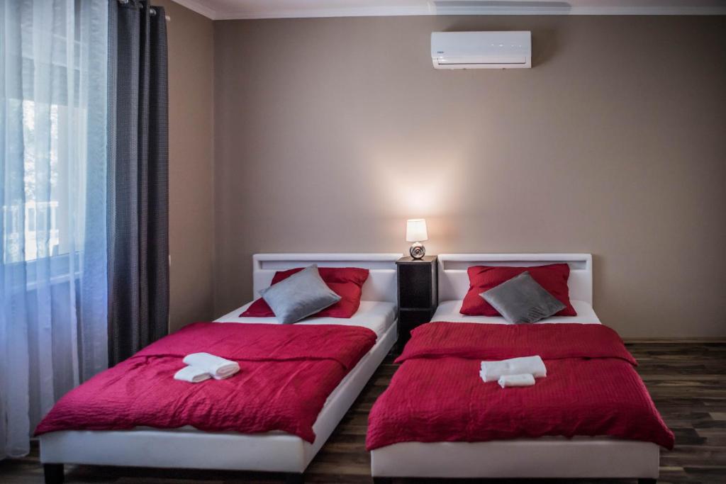 Postel nebo postele na pokoji v ubytování Virág Vendégház