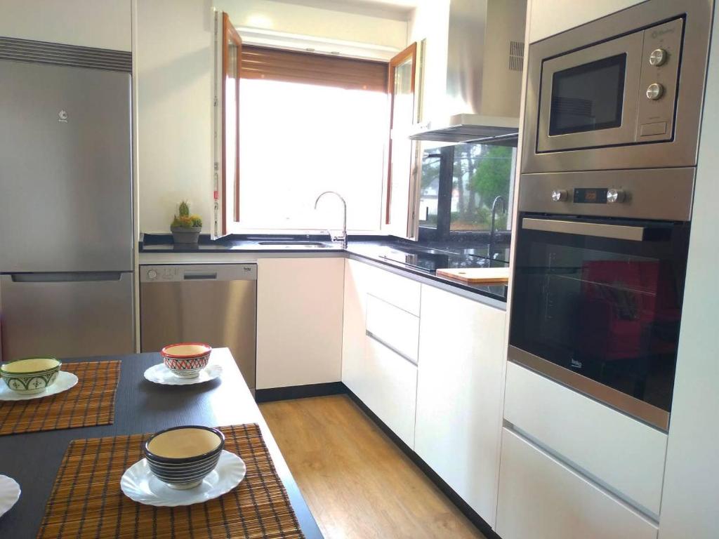 Kuchyňa alebo kuchynka v ubytovaní Apartamento Begoña