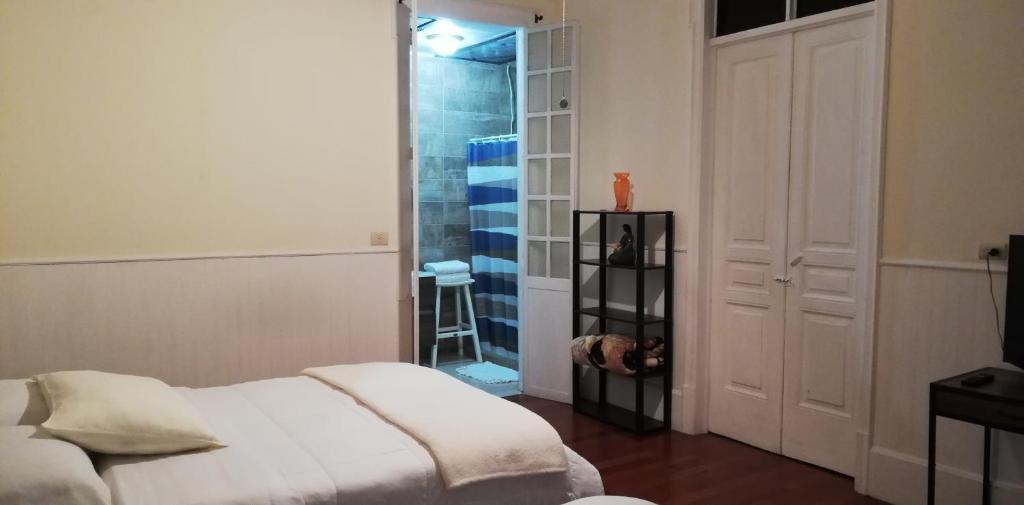 Postel nebo postele na pokoji v ubytování Casa Mayela Guest House