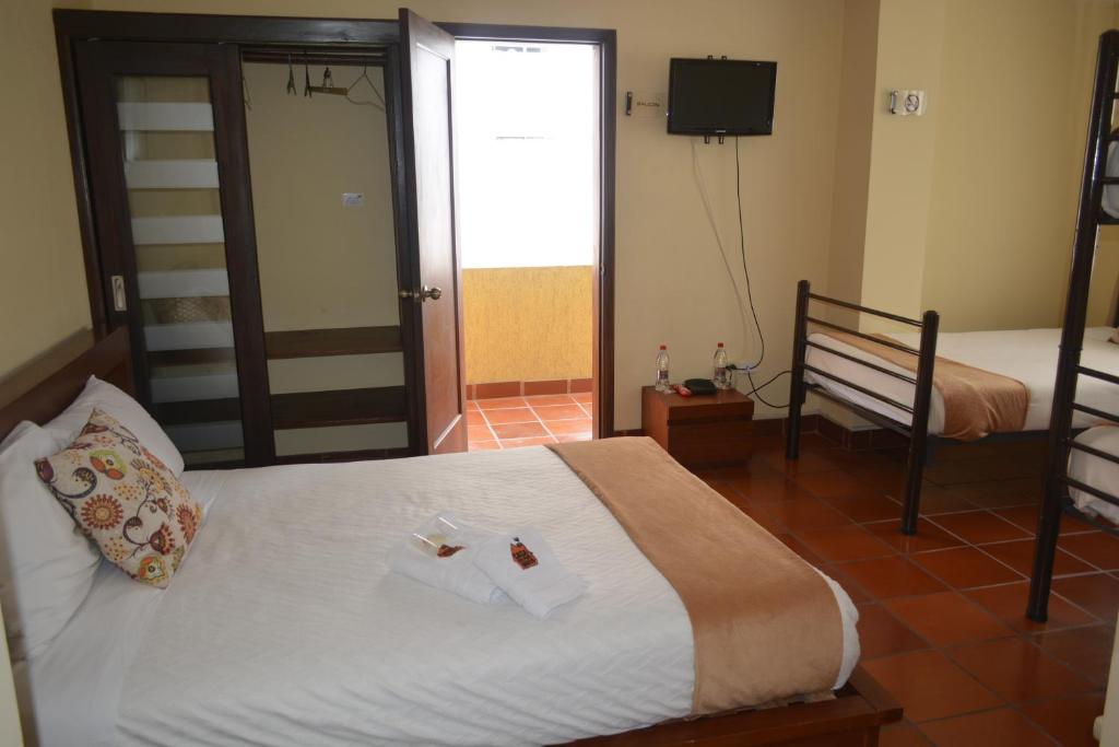 Postel nebo postele na pokoji v ubytování Hotel Casa Kolping Quito