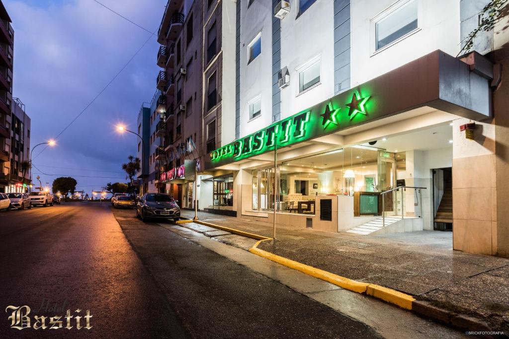 a building with a sign on the side of a street at Hotel Bastit in Mar del Plata