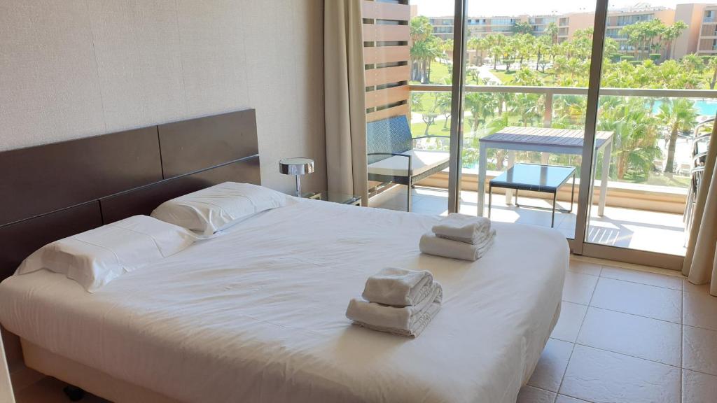 Postel nebo postele na pokoji v ubytování Apartamento Salgados Beach